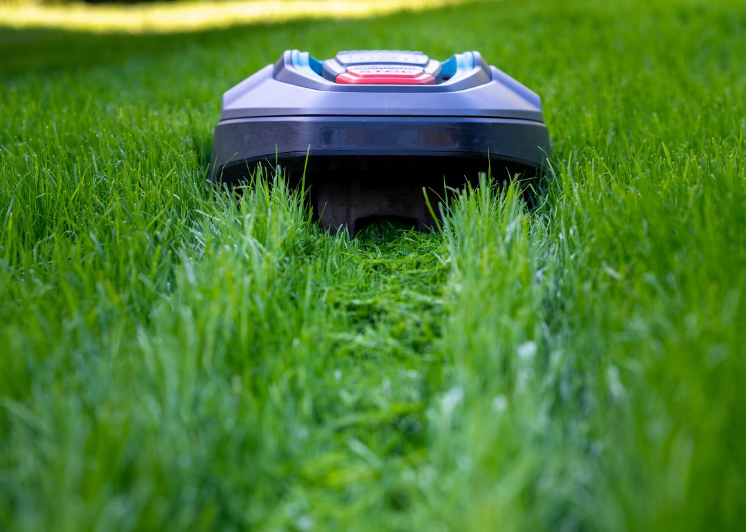 A robot mower cutting high grass.