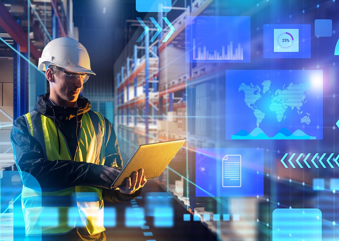 A male worker using laptop in a warehouse with an overlay of technology and logistics graphics.