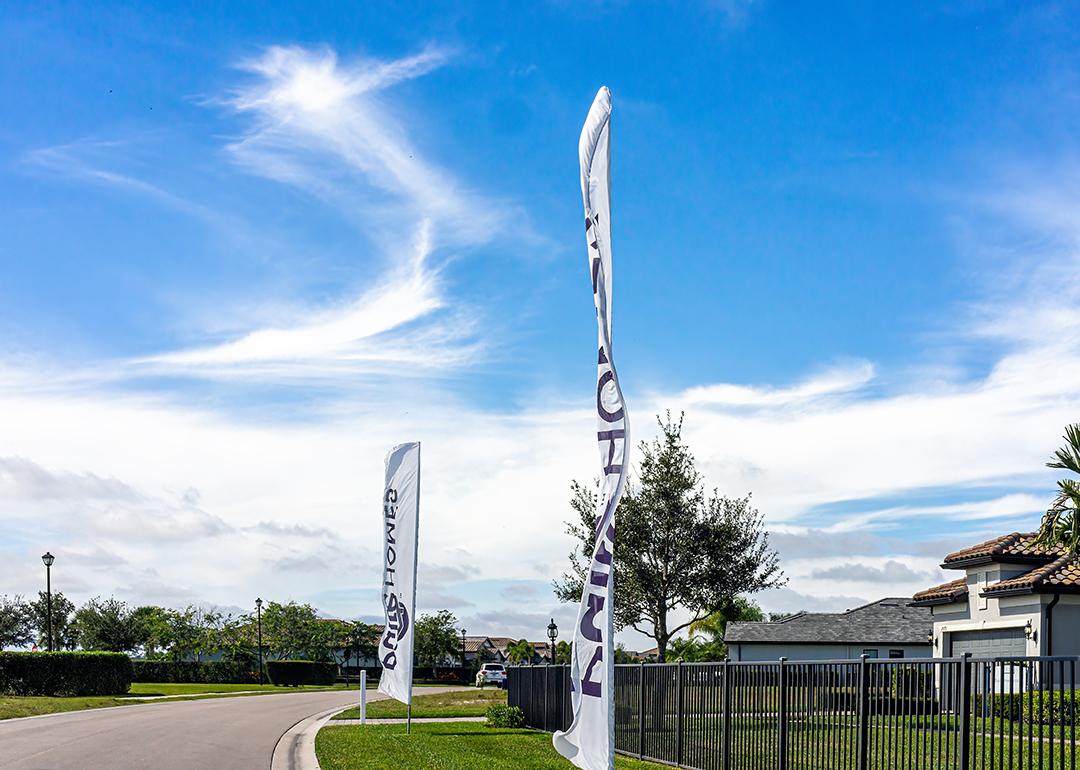 Sign banner flags outside a residential home community built by developer company, Pulte PulteGroup, in Florida.