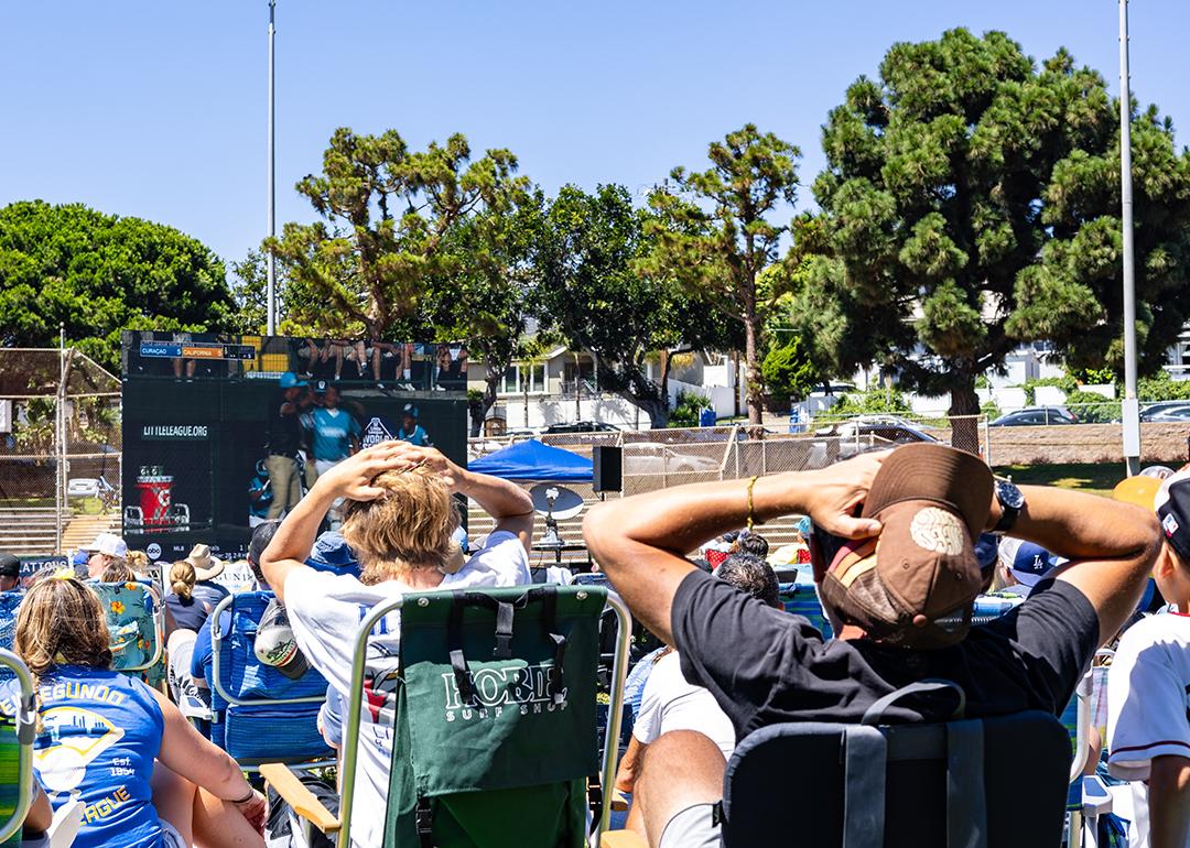 Audience put their hands on their heads in shock at the 2023 Little League World Series in El Segundo, California.