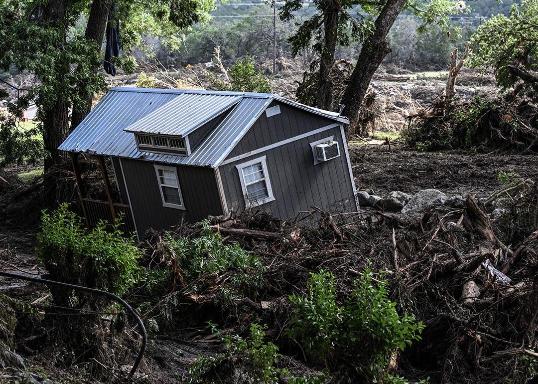 A damaged house is seen near the Guadalupe River in Hunt, Texas, on July 8, 2025, following severe flash flooding over the July 4 holiday weekend. 