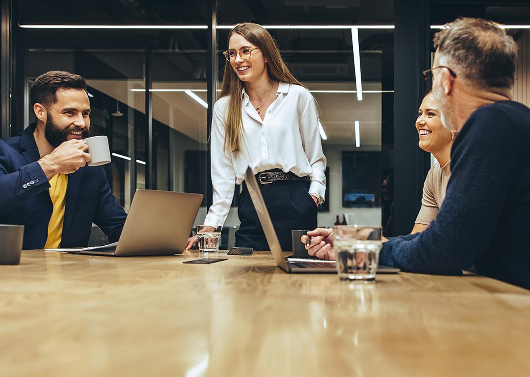 A happy business team having a meeting in a boardroom.