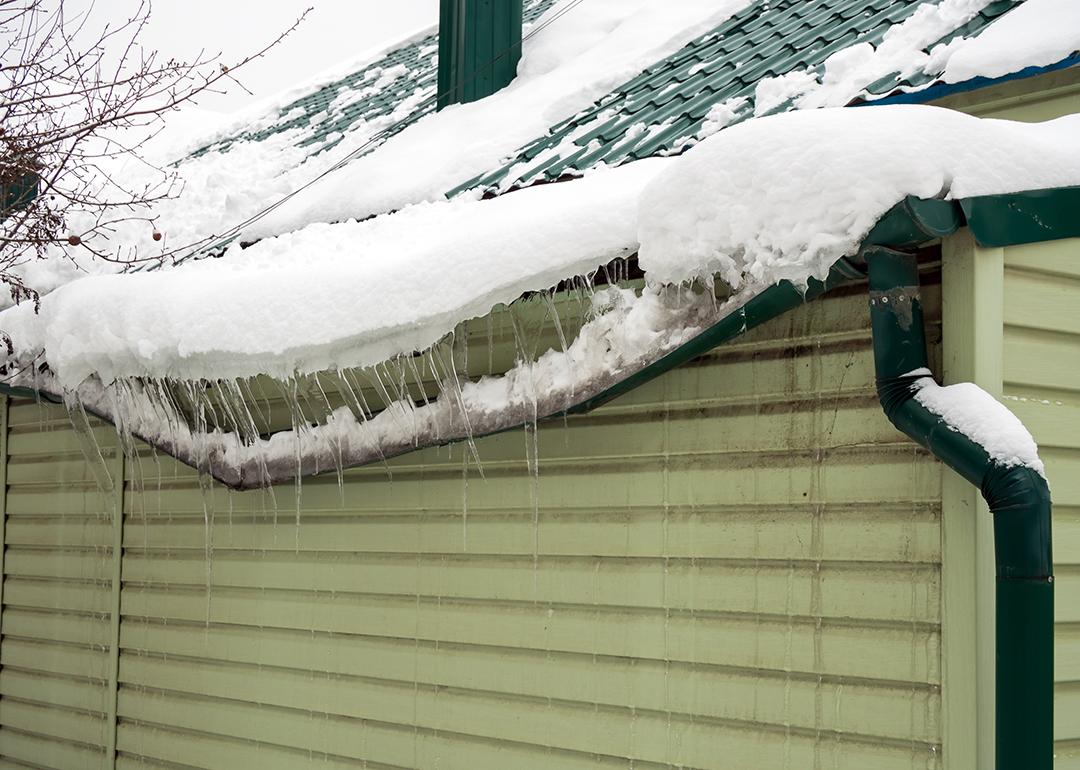 Heavy snow destroys as it accumulated on a home's drainage system.
