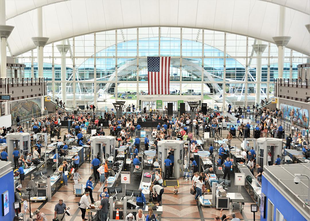 Travelers form long lines at the TSA screening areas of Denver International Airport.