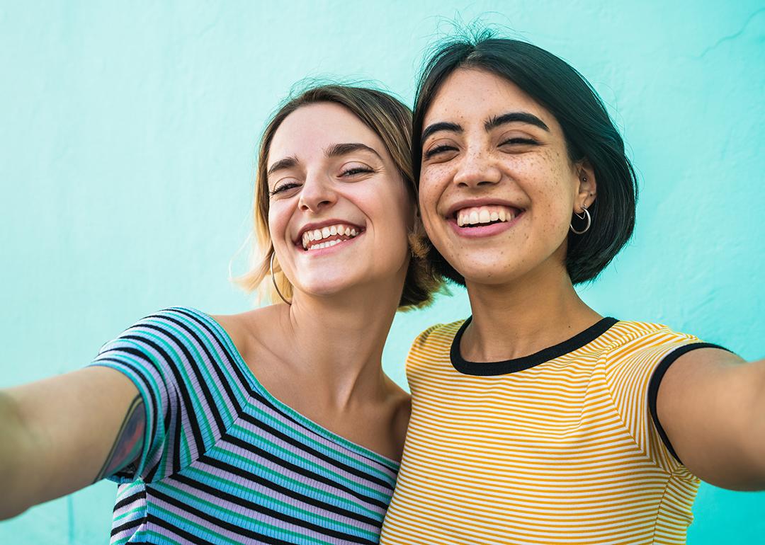 Two young women smiling for a selfie-style photograph.