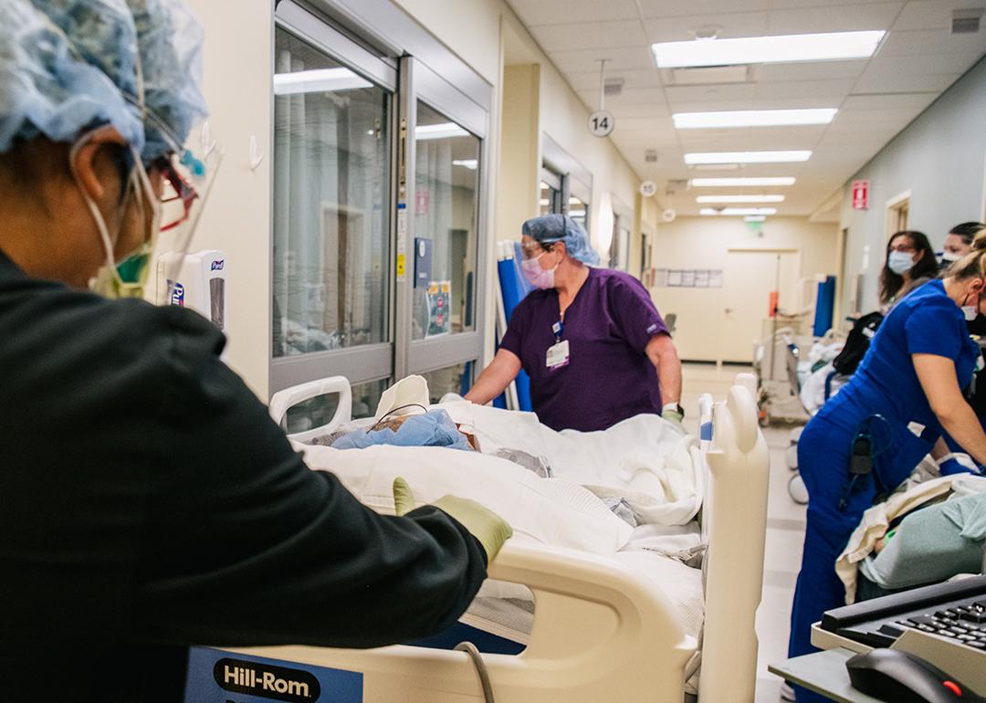 Emergency Room nurses fill a hallway as they tend to patients at the Houston Methodist The Woodlands Hospital in Texas.