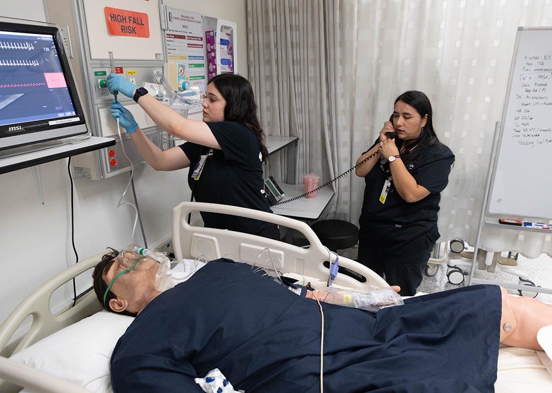 Students practice with a mannequin simulating a patient at the Mt. San Antonio College campus in California.