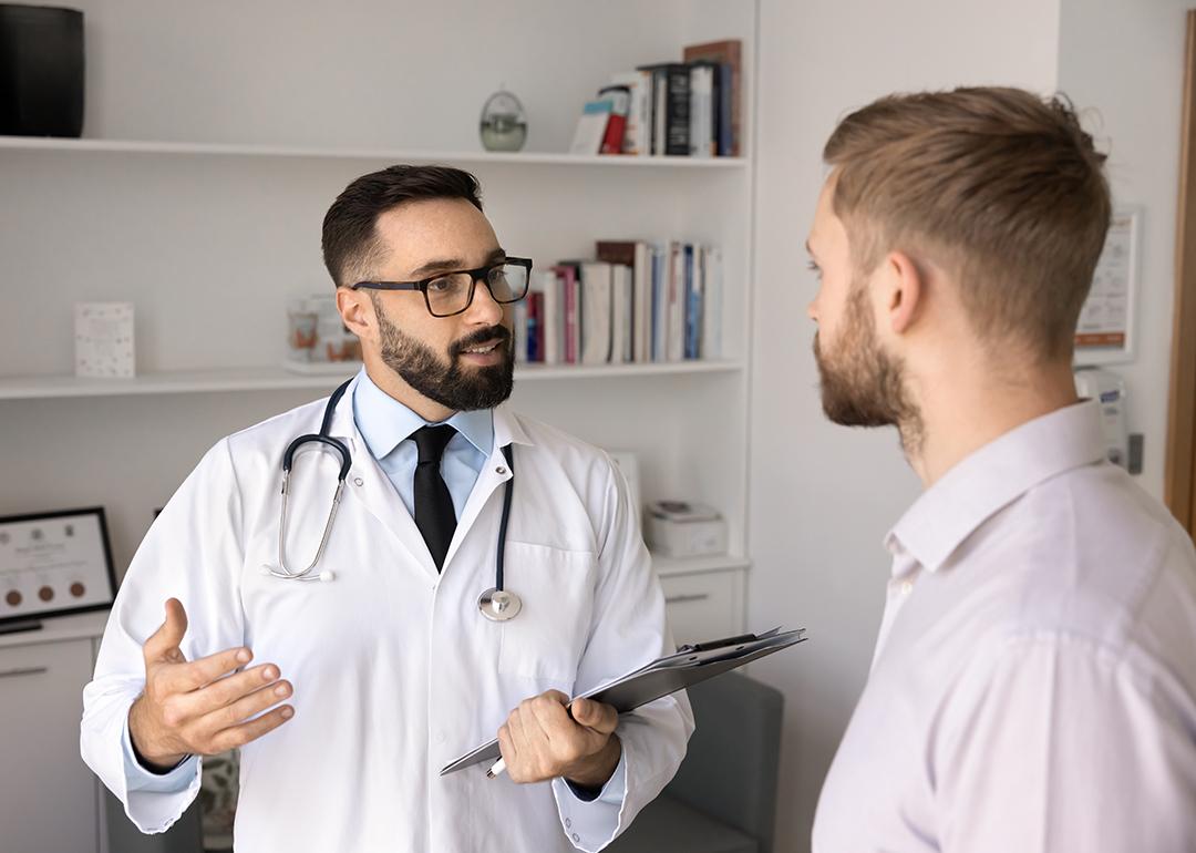 A young man consults with a physician.