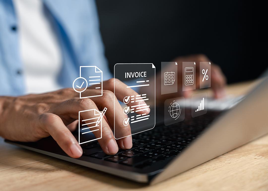 Business expense software concept using invoice graphics illustrated over a person using a laptop.