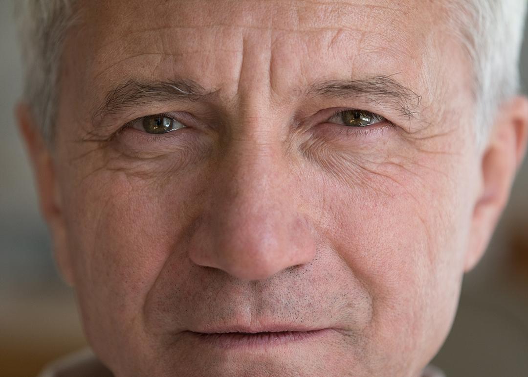 A close up photograph of a white elderly man.