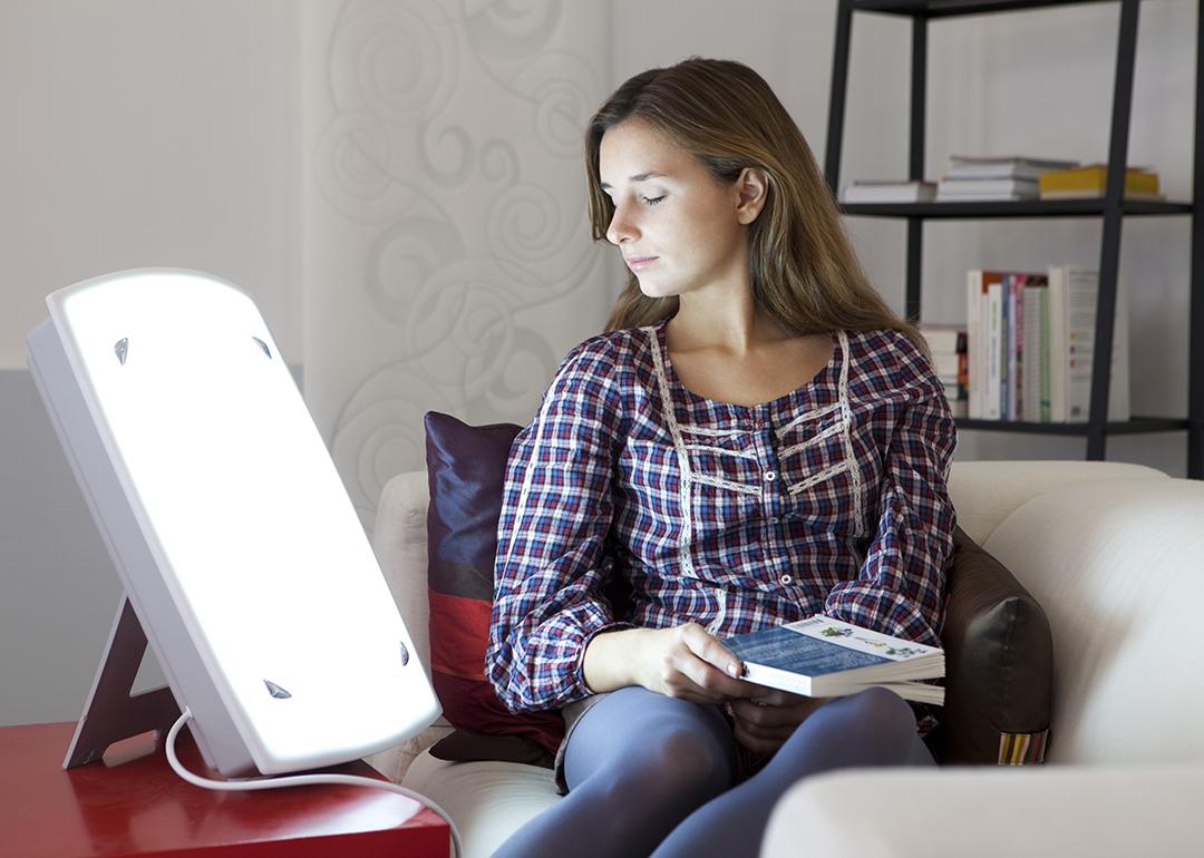 A young woman undergoing light therapy.