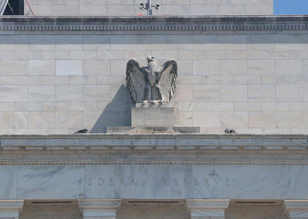 The Federal Reserve building with a figurine of the eagle above the doorway visible as it goes under construction on July 17, 2025 in Washington, DC. 