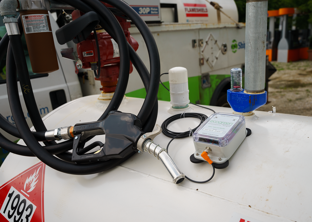 A fuel monitor device and a pump on top of a gas tank.