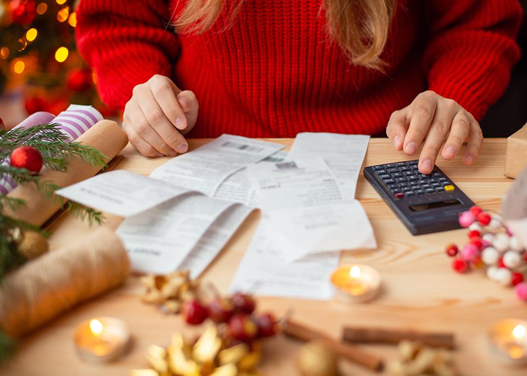 Person calculating expenses for the holidays.