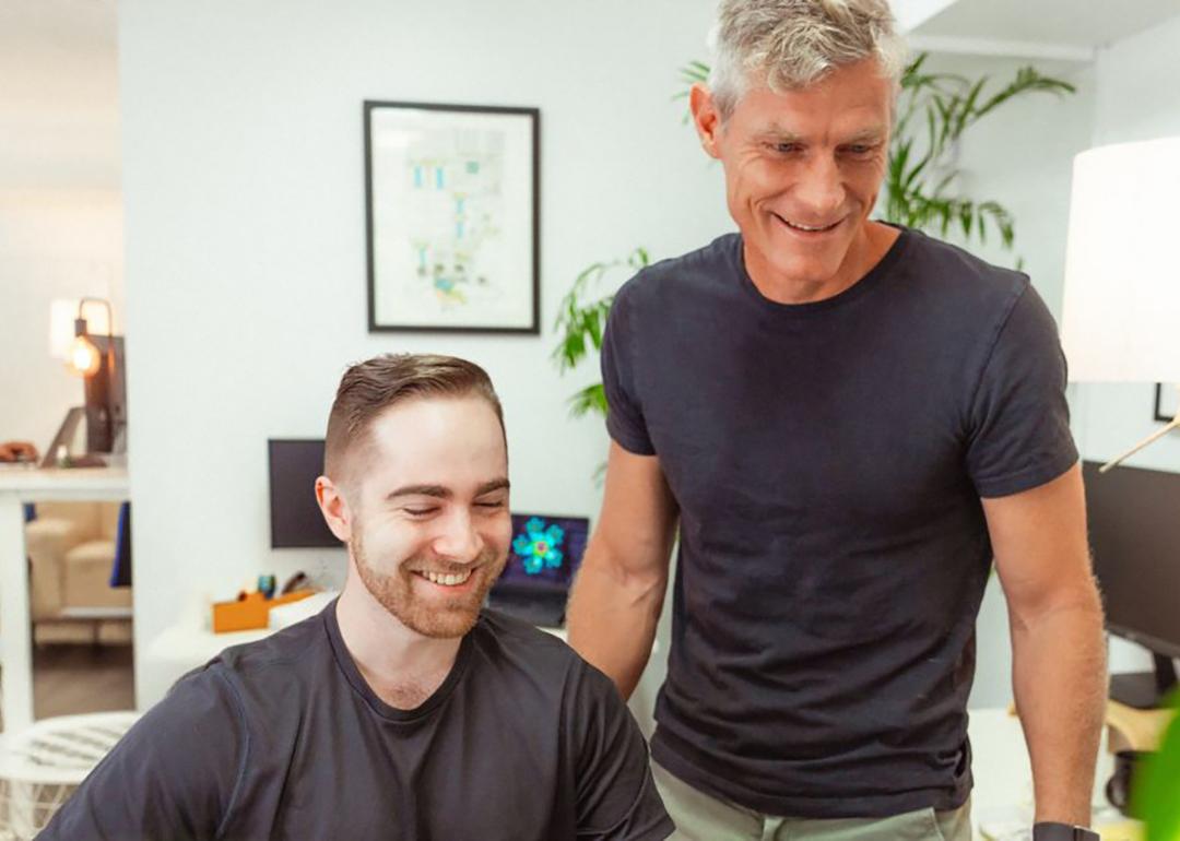 Startup professionals checking on a project in an office.
