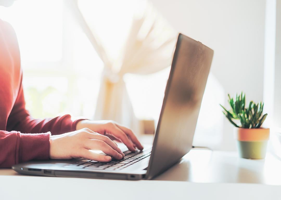 Person typing on a laptop.