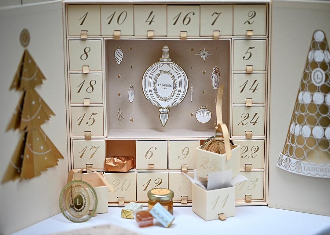 Ladurée gold Advent calendar displayed at their shop.