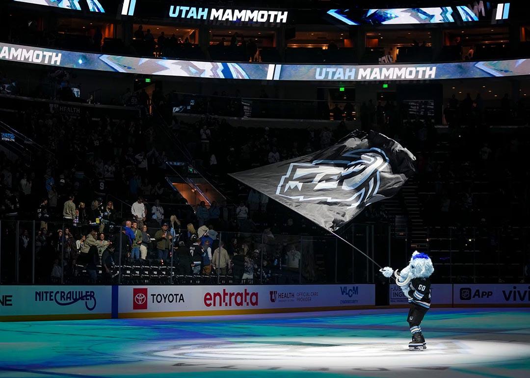 Tusky, the mascot for Utah Mammoth, waves a flag at center ice after the game against the San Jose Sharks at Delta Center in Salt Lake City on Friday, Oct. 17, 2025.