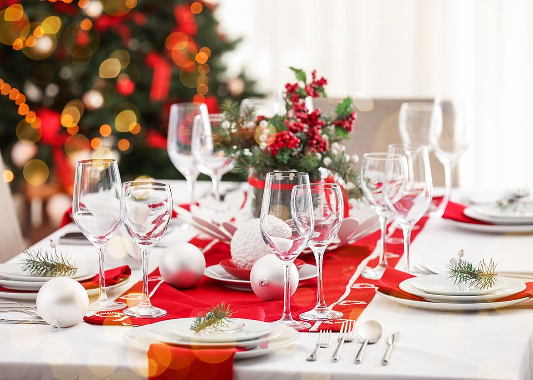 A beautiful Christmas dinner table setting with red and white motifs.