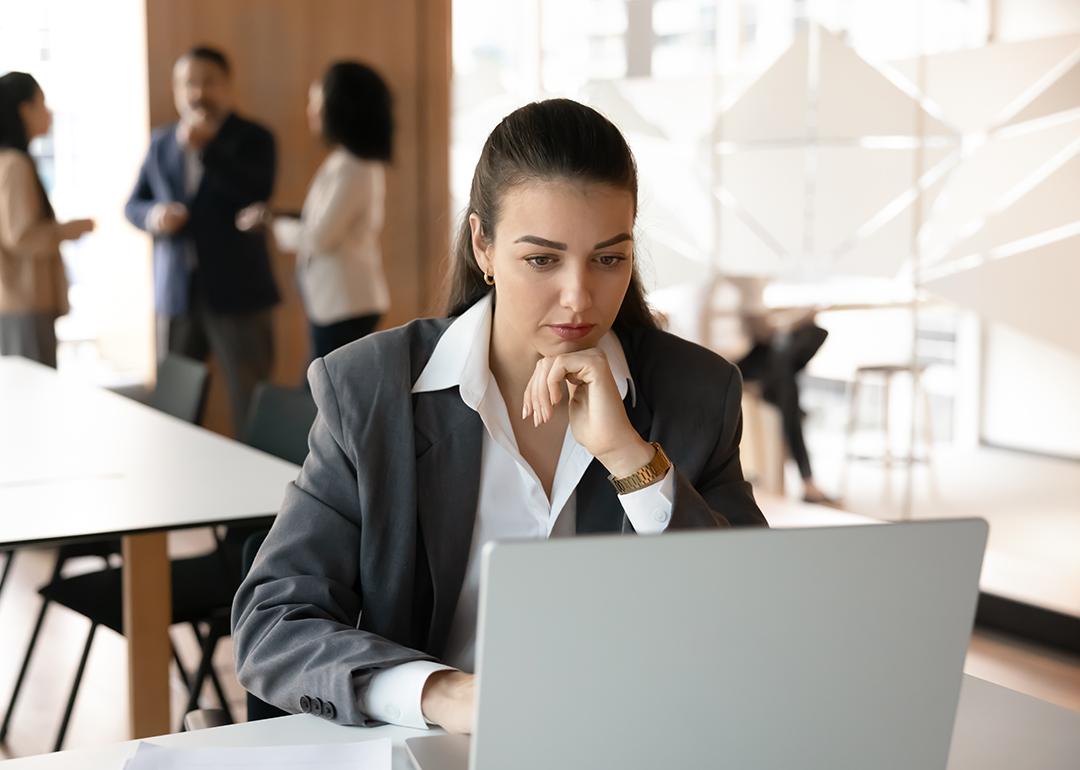 A young female professional working in a corporate office.