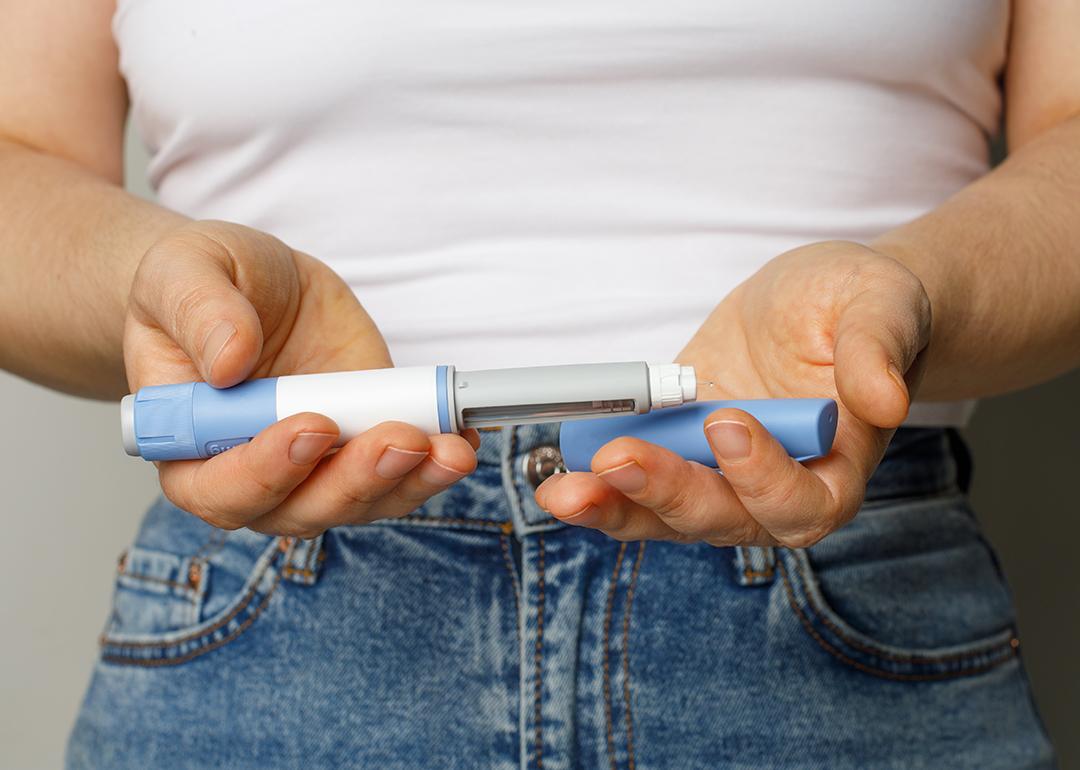 Person holding a Semaglutide pen.