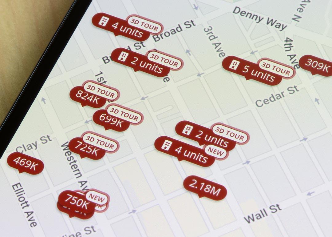Homes listed for sale in Seattle, Washington, are seen on the map in the Zillow app on a smartphone.