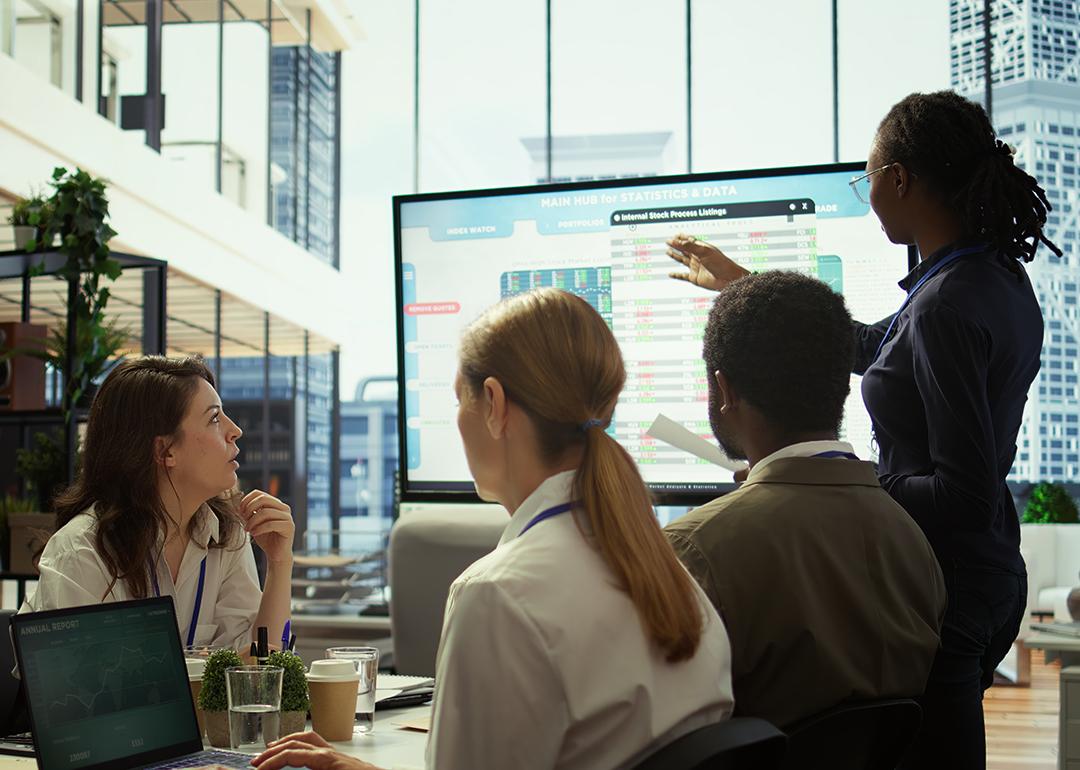 An accounting team reviewing budget and financial reports.
