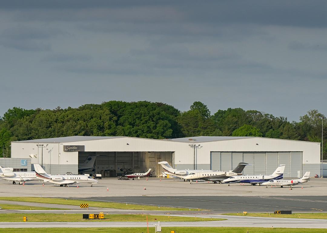 Private jets lined up outside at an airport terminal in Baltimore.