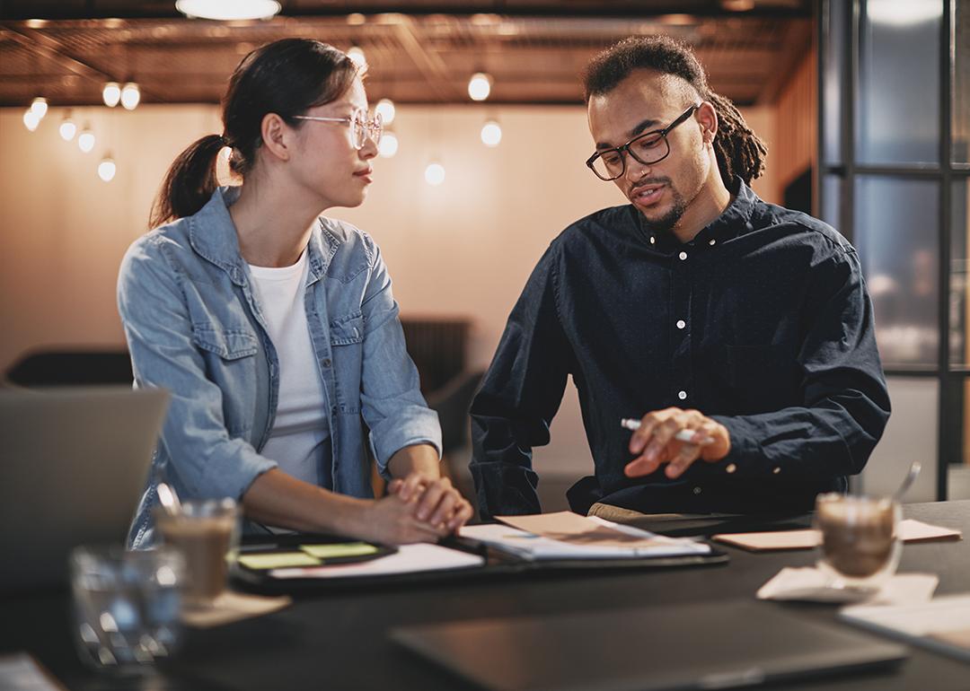 Two business people engaged in a discussion.