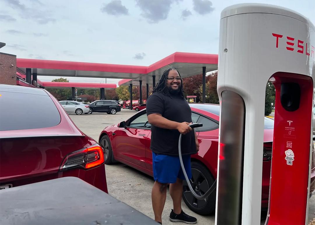 Phillip Stafford charges his car with a Tesla charger at his preferred gas station, Sheetz.