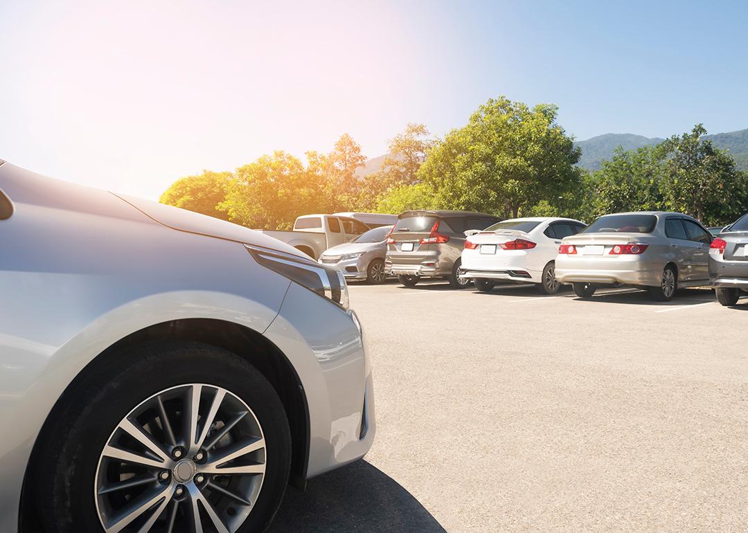 Parking lot with cars parked.