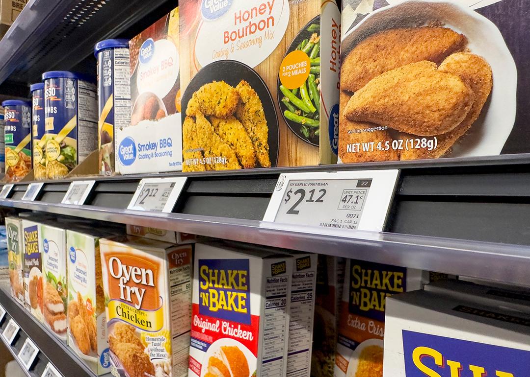 Digital price tags on display for the seasoning mix shelf in a grocery.