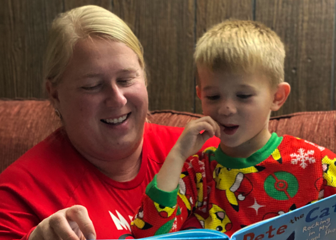 Jeana Wallace reading a book to her son, Levi, during bedtime.