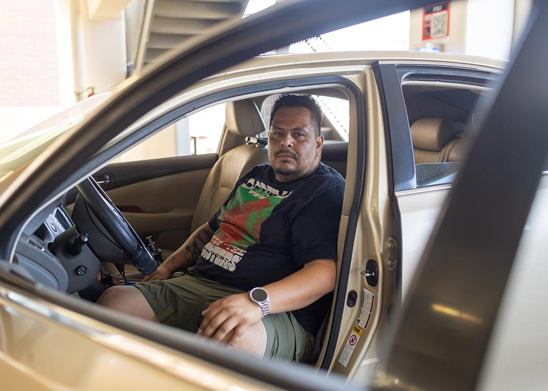 Edgar Rosales Jr. sits in the car where he lived for more than a year as a participant in the Safe Parking Program at Long Beach City College in Long Beach, Calif. There, he said, “you don’t have to be scared.”