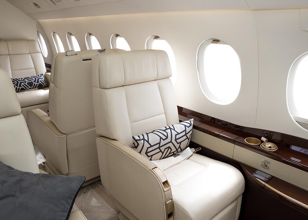 Cream-colored leather seats in a private business jet.