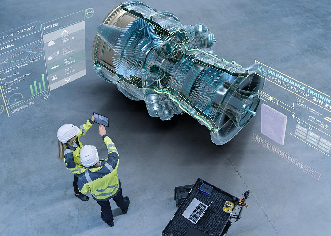 Aircraft engineers using augmented reality software for jet engine diagnostics.