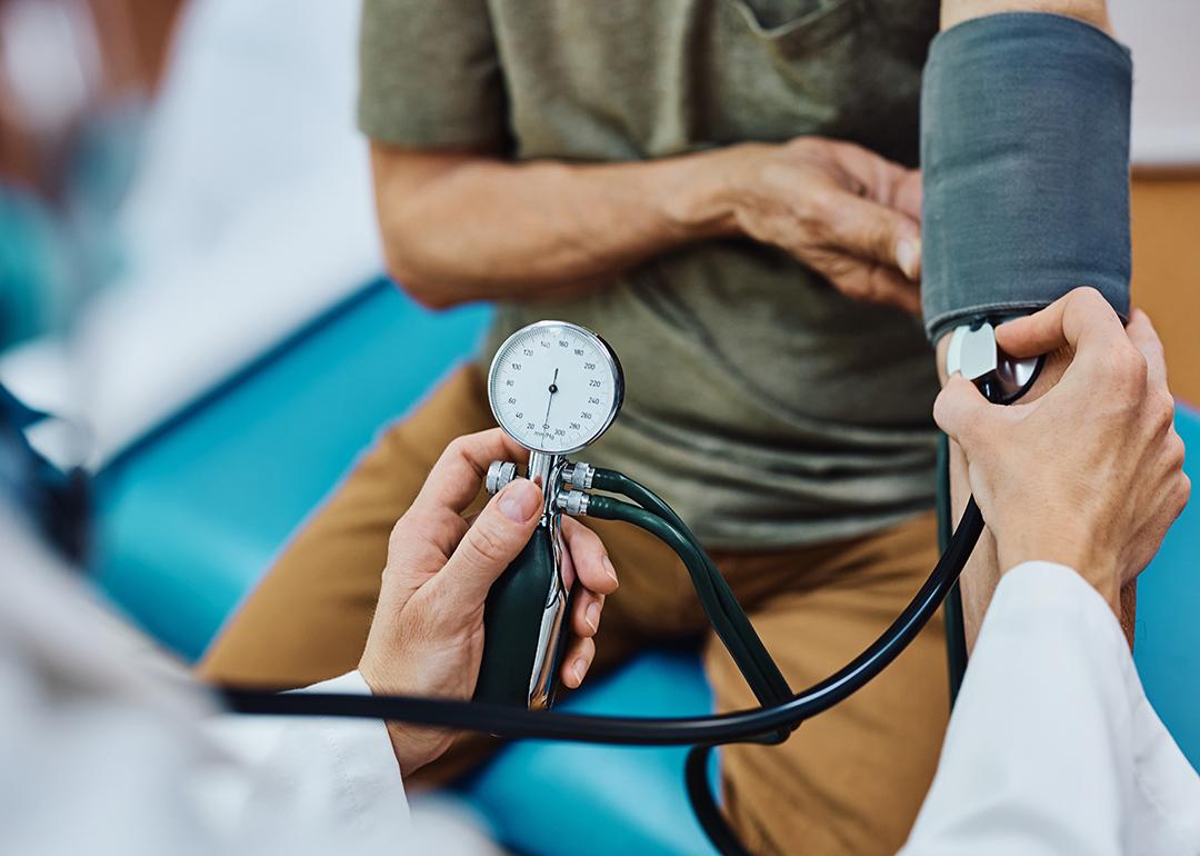 A senior man getting his blood pressure checked.
