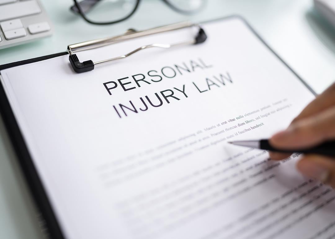 Personal Injury Law document on a clipboard.