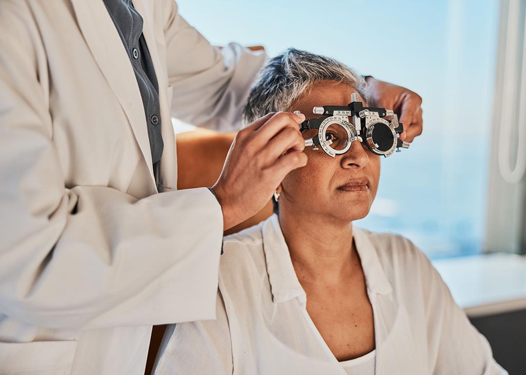 A senior woman getting a vision test for eyeglasses.