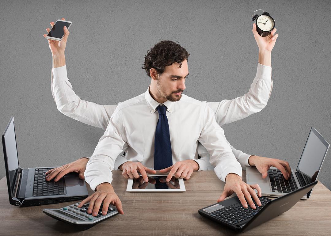 A businessman illustrated with multiple arms and hands as a concept of multitasking.