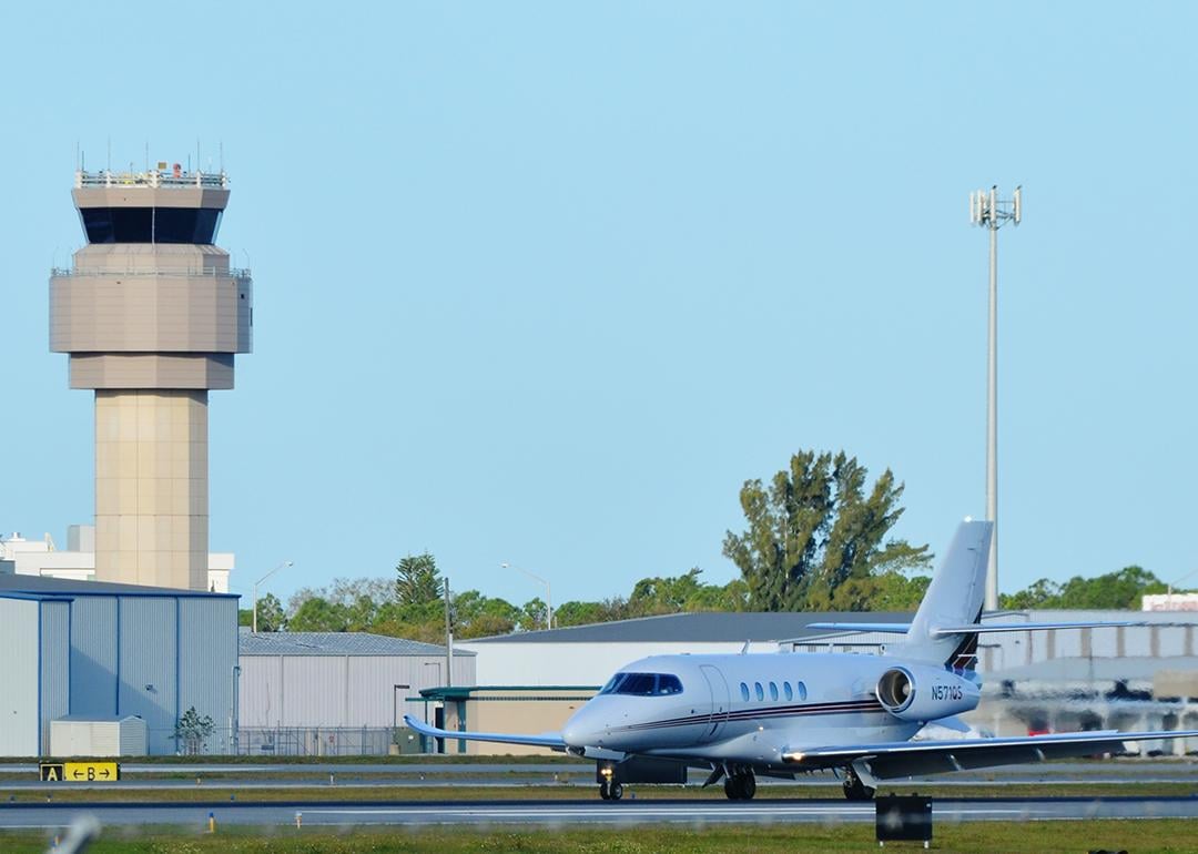 A private Charter Cessna Citation Latitude Jet on a runway in Sarasota-Bradenton International Airport.