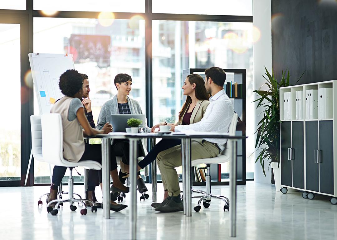A group of businesspeople having a meeting together in a modern office