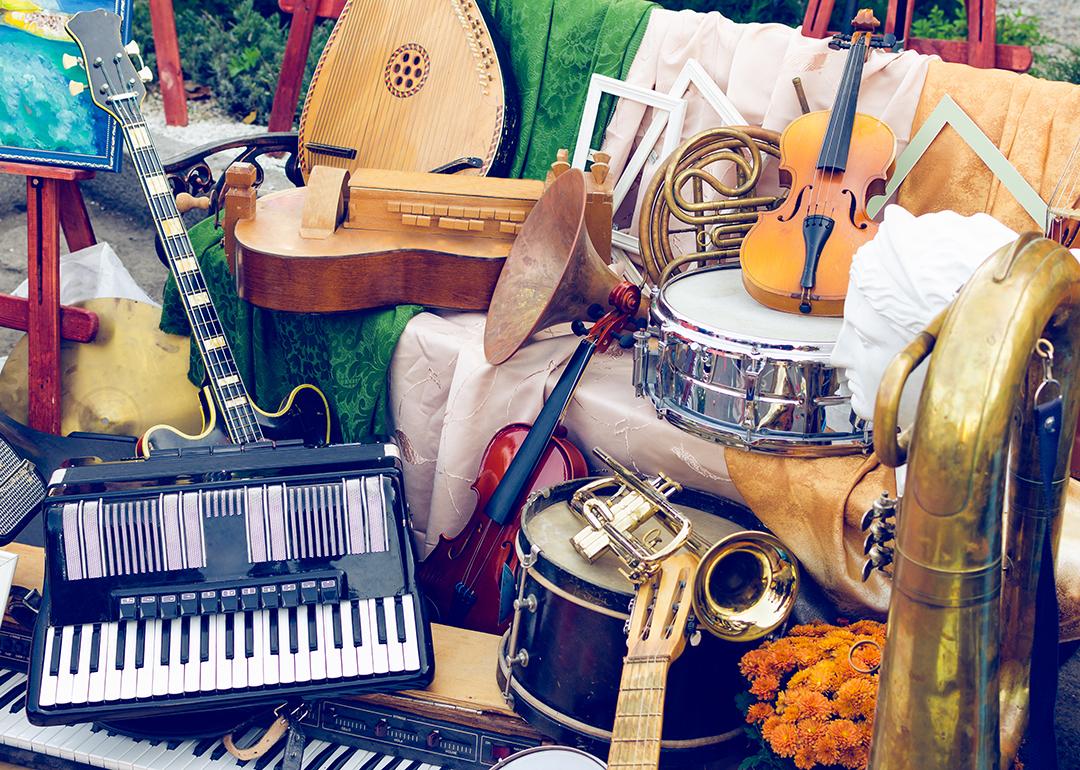 A pile of different musical instruments.