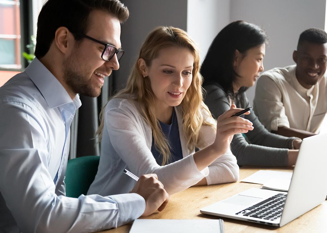 A diverse corporate team working together on a project.