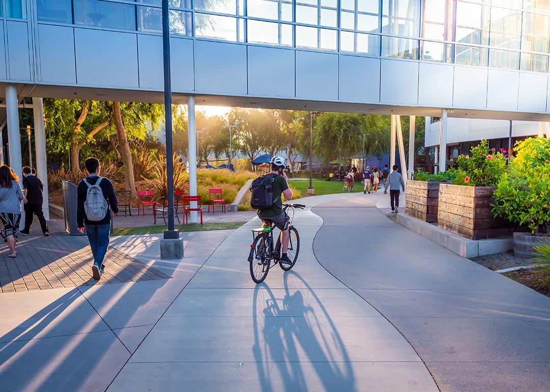 People walking and cycling around the Google headquarters.