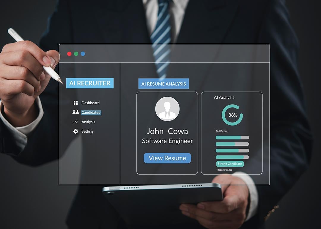 An AI recruitment software graphic over a businessman using a tablet.