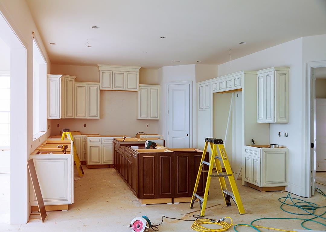New cabinet installment in progress for a modern kitchen.