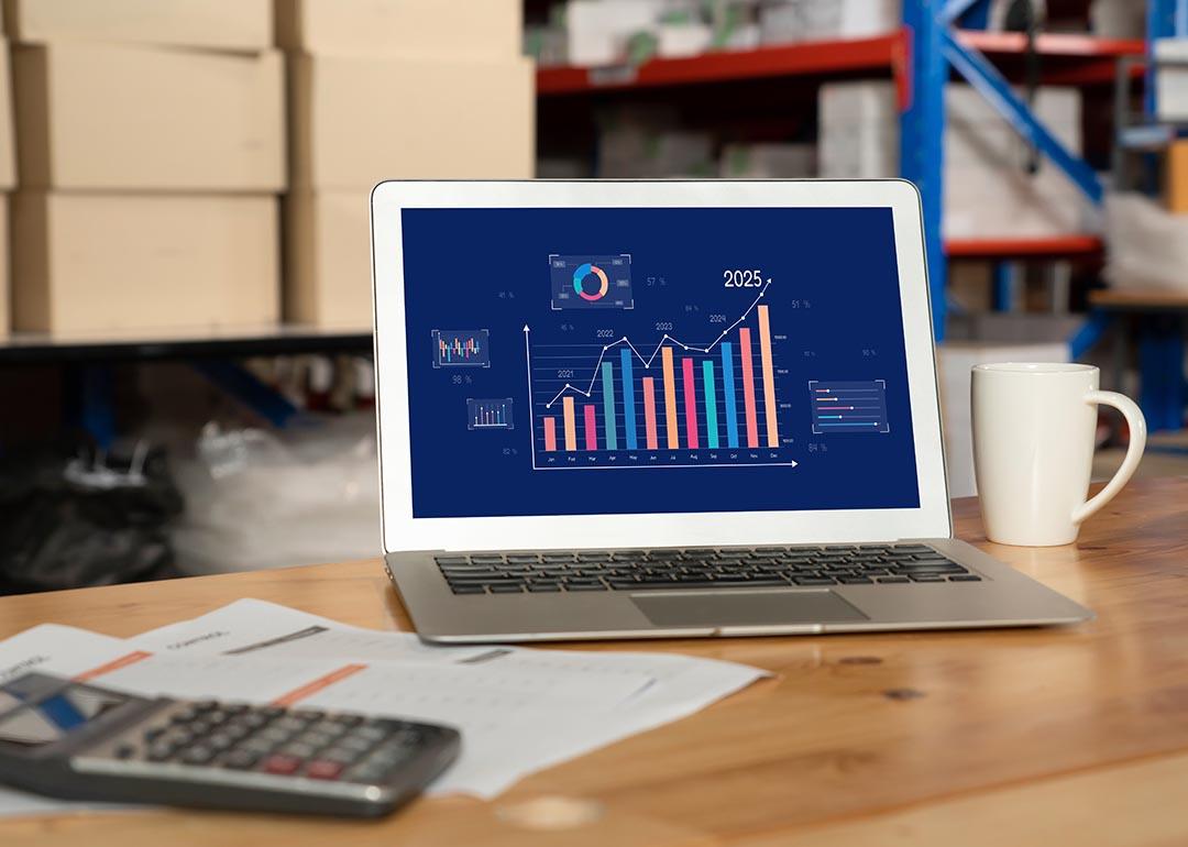 Data dashboard displayed on a laptop inside a warehouse.