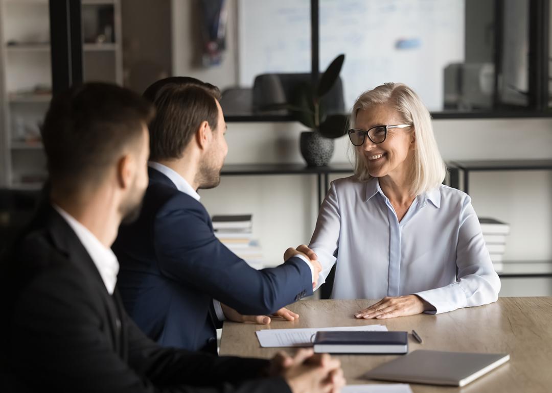 Business partners shaking hands during a meeting.