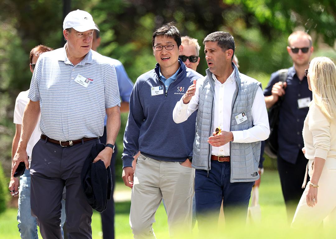 Bom Kim (center), founder and CEO of Coupang, walks with investor Stan Druckenmiller and member of the Federal Reserve Board of Governors Kevin Warsh during the Allen & Company's annual Sun Valley Conference on July 13, 2023 in Sun Valley, Idaho.